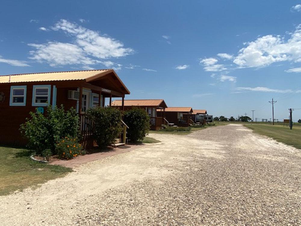 The gravel road that leads to the rental cabins at SILVER WIND RV PARK AND CABINS