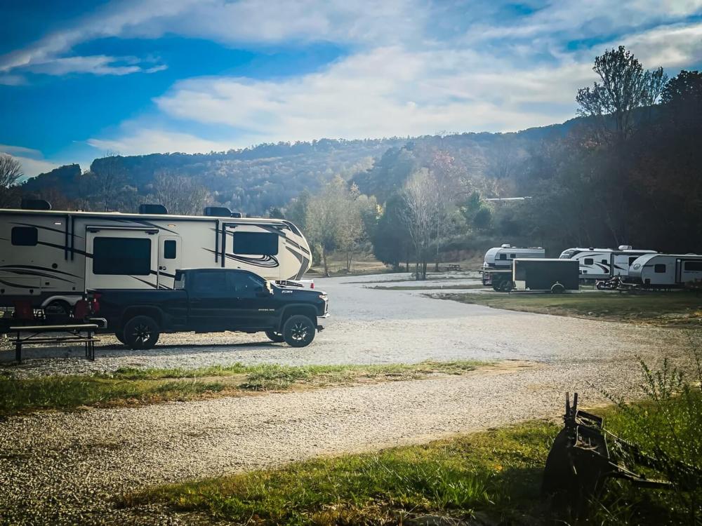 Parked trailer next to pickup truck at Rocky Top Campground