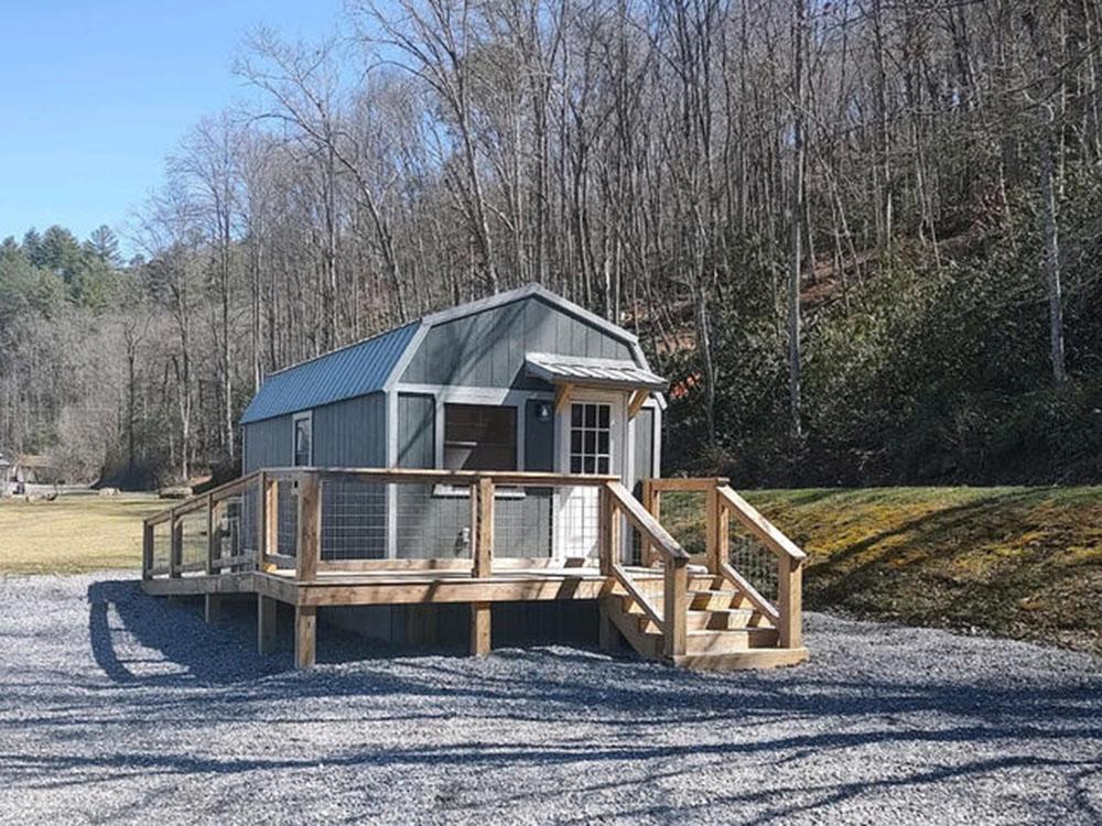 Small gray cabin at SWEETWATER SIGHTS RV PARK & CABIN RENTALS