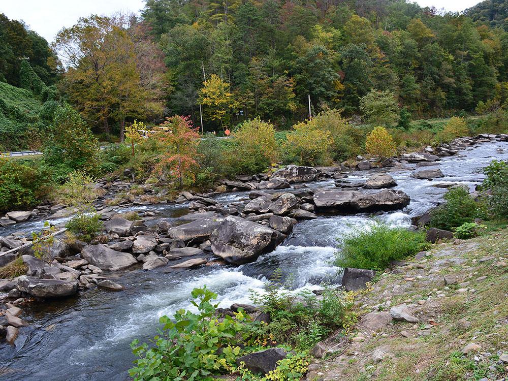 Creek with rocks at SWEETWATER SIGHTS RV PARK & CABIN RENTALS