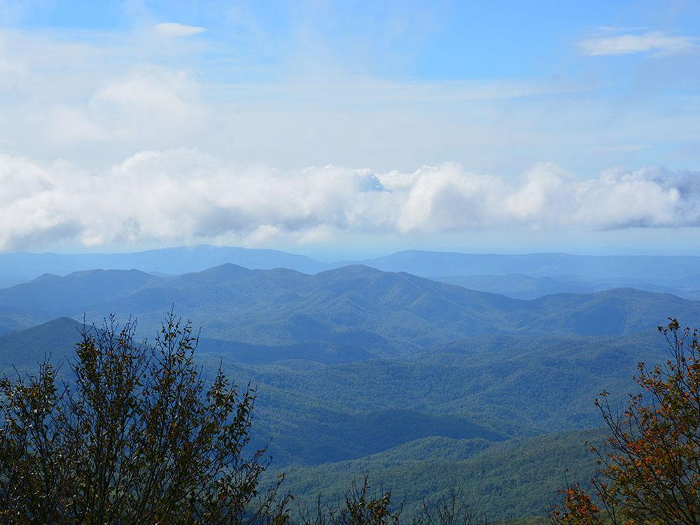 View of the blue sky and mountains at SWEETWATER SIGHTS RV PARK & CABIN RENTALS