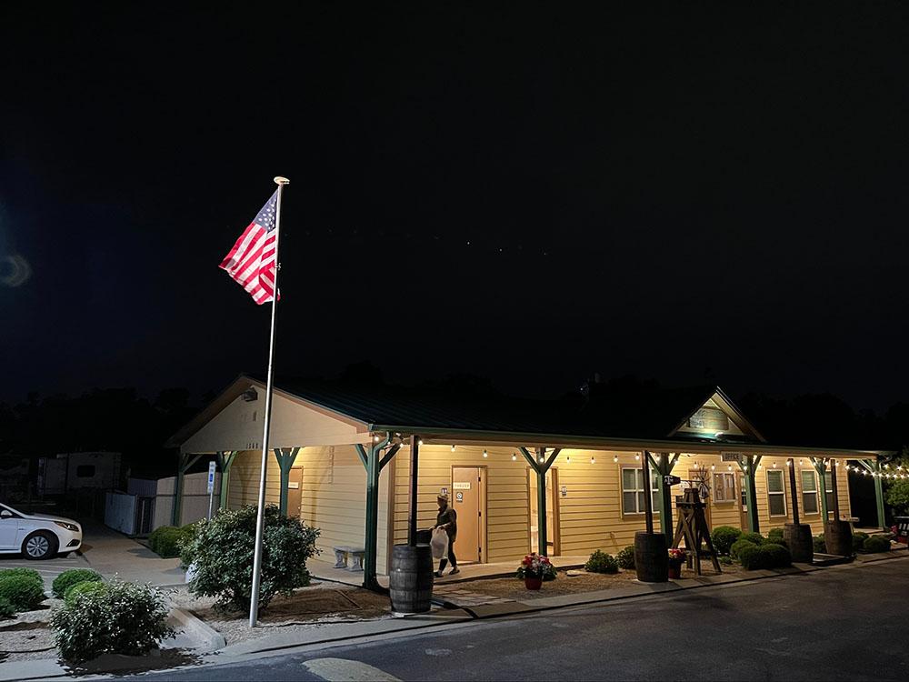 The office building lit up at night at TIMBER RIDGE RV PARK