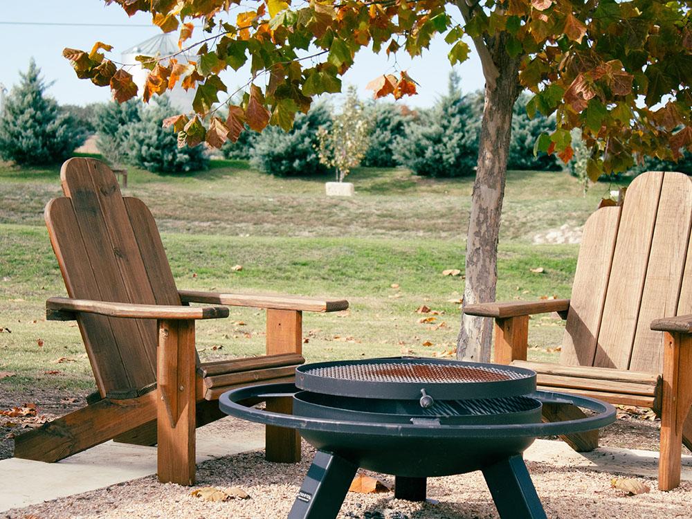 Seating at a fire pit at STARDUST AIRSTREAM RV RESORT AT CEDAR BREAK LODGING