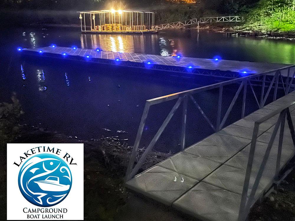 Dock with blue lights at night at LAKETIME RV CAMPGROUND