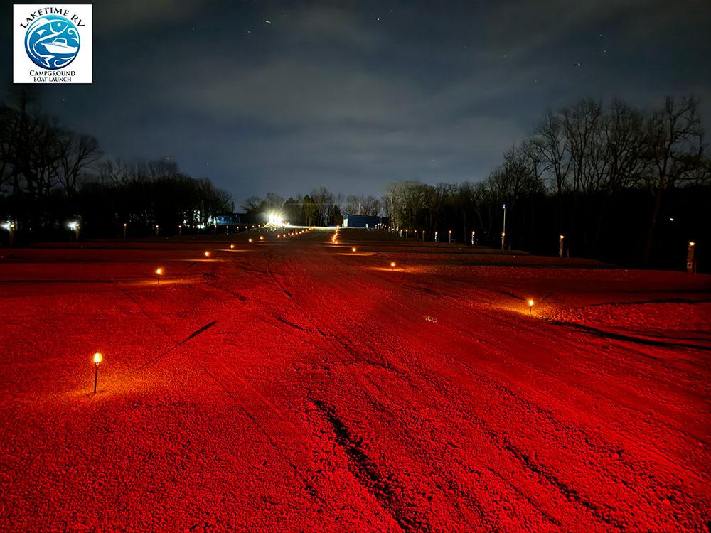 Gravel sites glow at night at LAKETIME RV CAMPGROUND