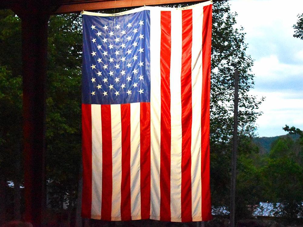 An American flag hanging at SMOKY MOUNTAIN PREMIUM CAMPING