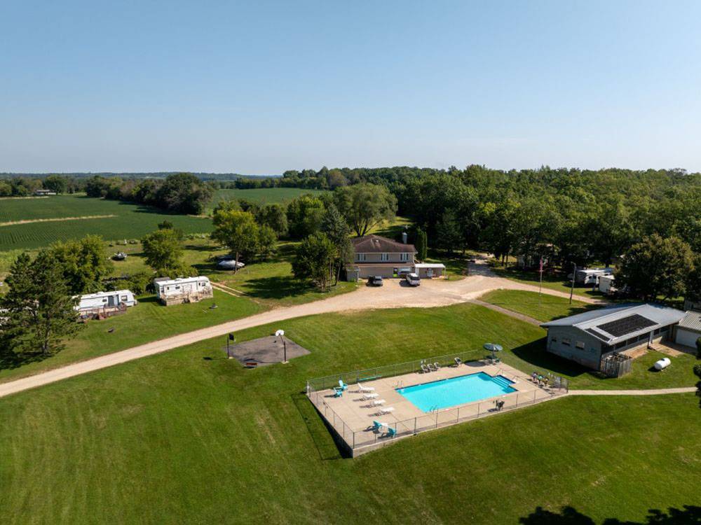 Aerial view of the pool, basketball court and building