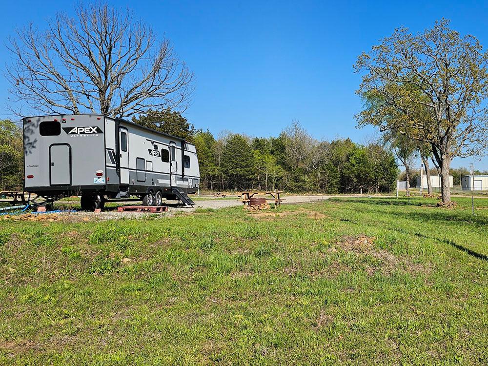 Site with some trees at SHOULD BE FISHING CAMPGROUND