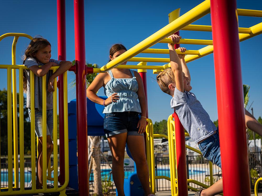 Kids playing at the playground at SANDUSKY RV RESORT