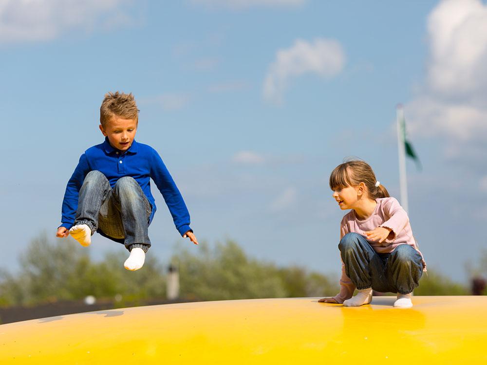 Kids on the bounce pillow at SANDUSKY RV RESORT