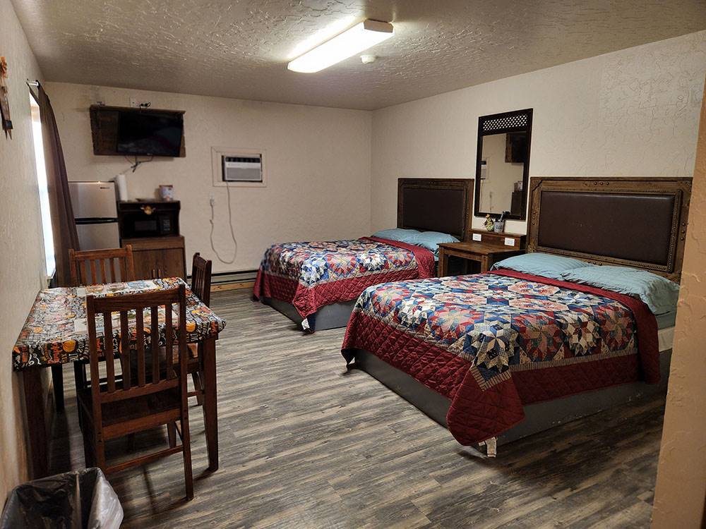 Two beds in a cabin at The Bunkhouse Cabins and RV Park