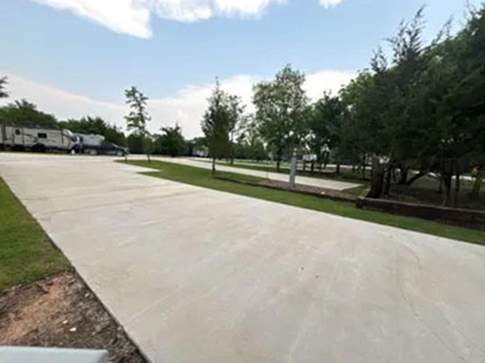 Side view of empty RV lot at SILO CREEK RV RESORT