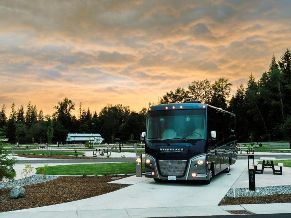 Class A motorhome in a paved site at ANGEL OF THE WINDS CASINO RESORT