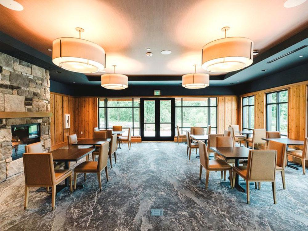 Interior of a dining area with stone fireplace at ANGEL OF THE WINDS CASINO RESORT