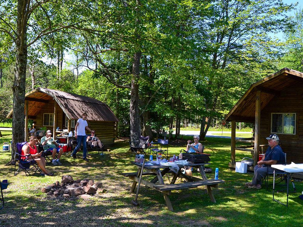 Group of people gathered at the cabins at KINZUA EAST KAMPGROUND