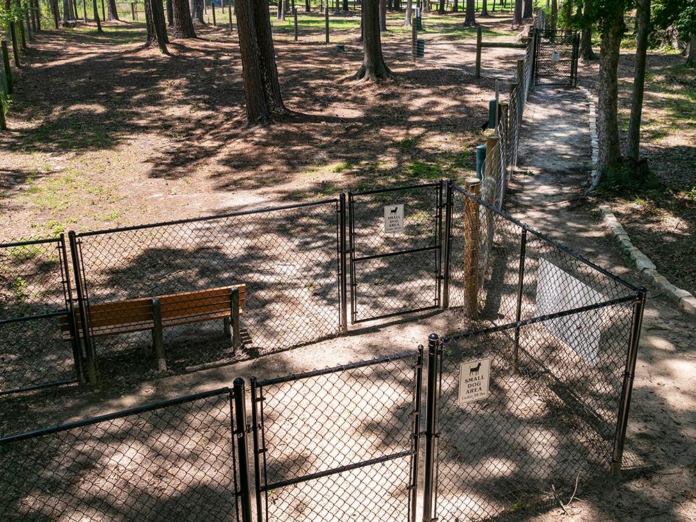 Enclosed dog area at WOODLAND CREEK RV PARK