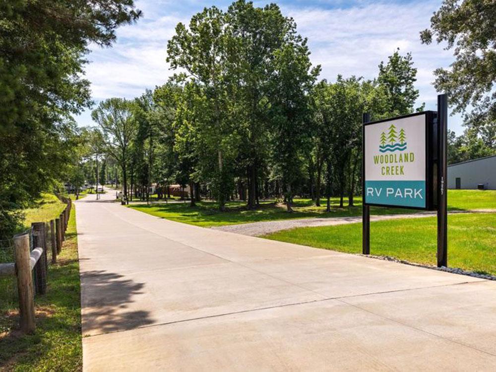 The park sign at the entrance to the park at WOODLAND CREEK RV PARK