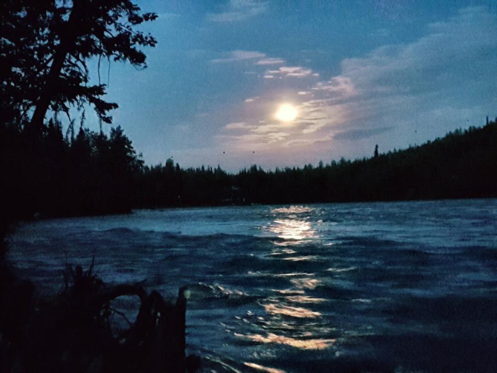 Lake at night at Bing Brown's RV Park and Motel