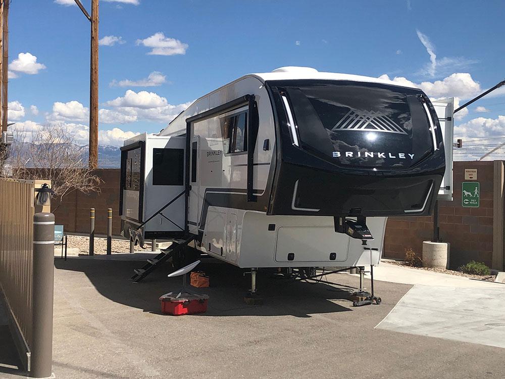 Fifth wheel with a slide-out at site at NOMADLAND RV STAY