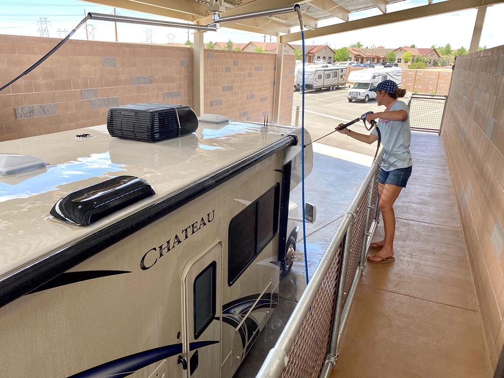 Woman on self-service RV wash catwalk at NOMADLAND RV STAY