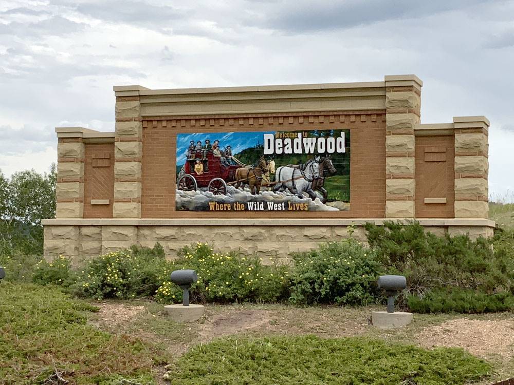 Welcome to Deadwood sign nearby at CanAmerican 85 RV Park