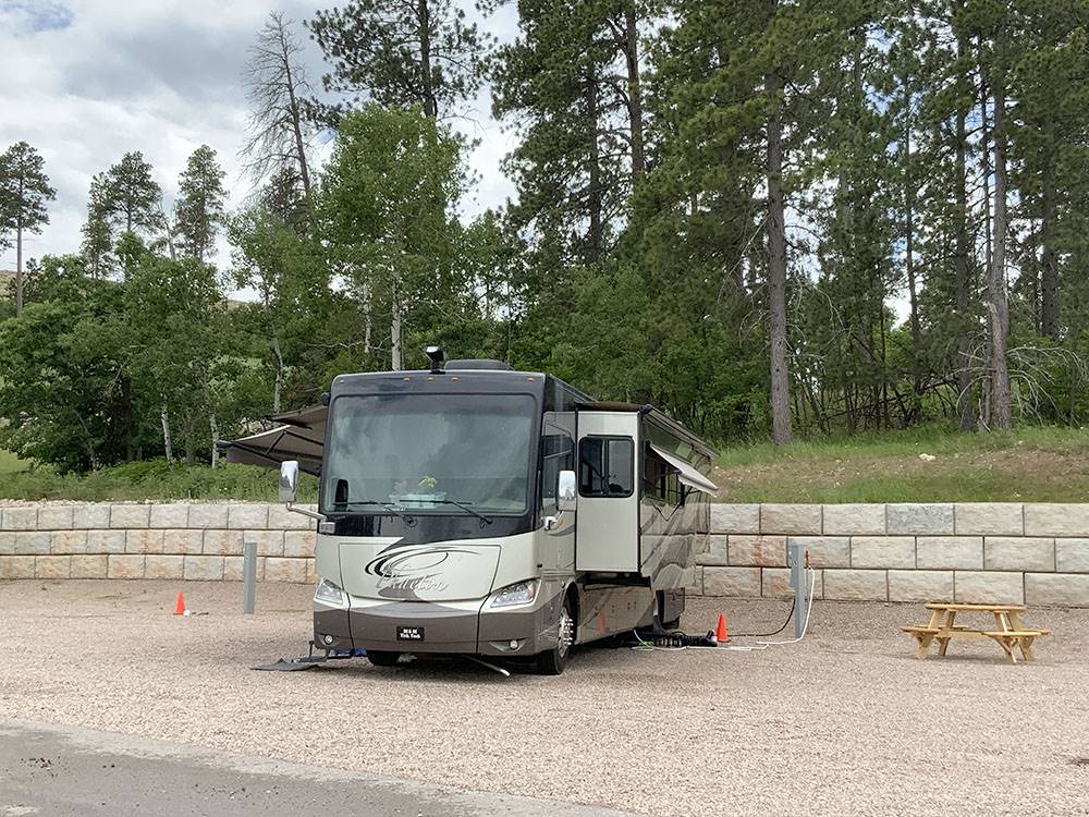 Class A motorhome and picnic table at CanAmerican 85 RV Park