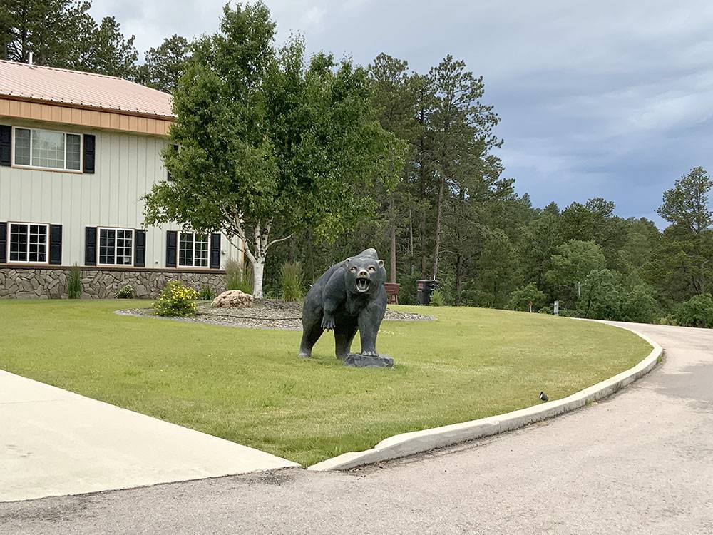 A bear statue in front of the office at CanAmerican 85 RV Park