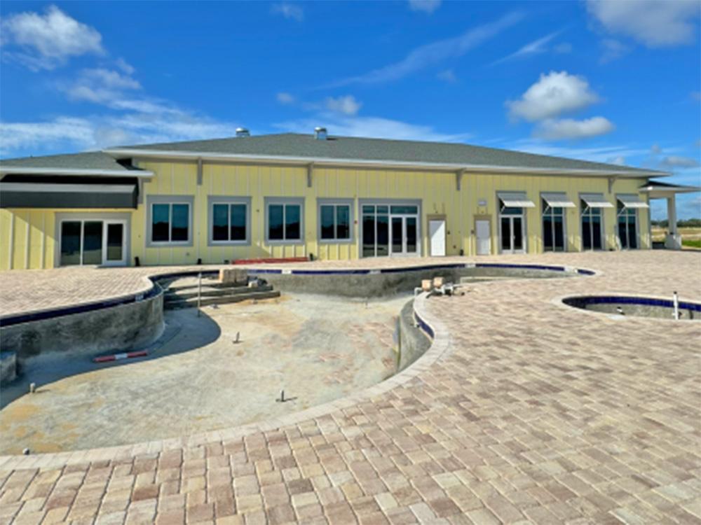 Pool construction behind building at WATERSIDE RV RESORT