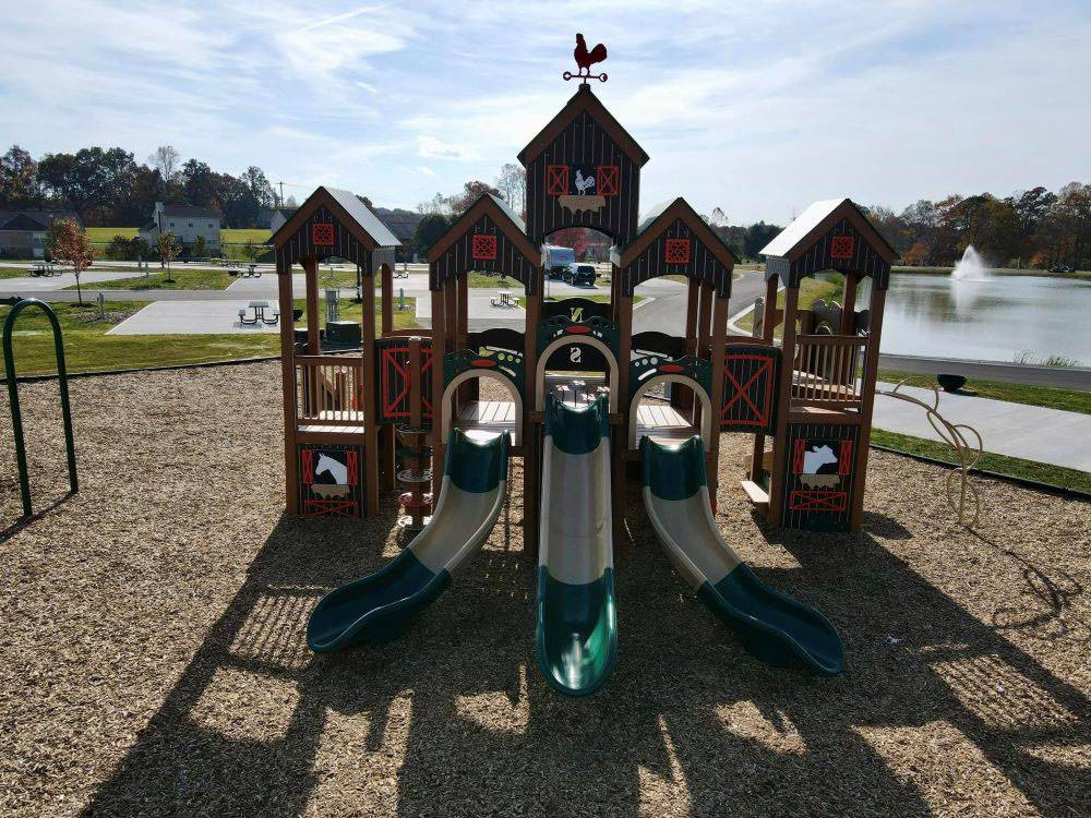 A large play structure on the playground at The Farm RV Resort