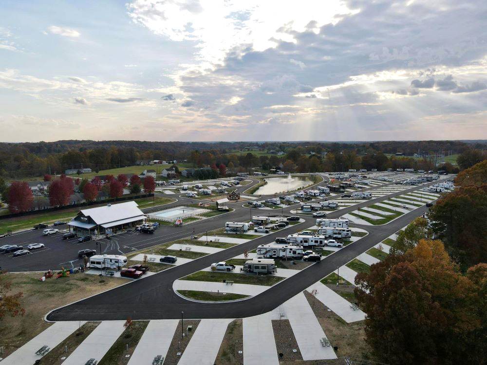 RV sites, the office and pond at The Farm RV Resort