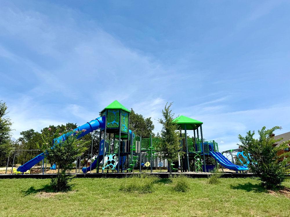 A play structure at the playground at RIVER'S EDGE CAMPGROUND