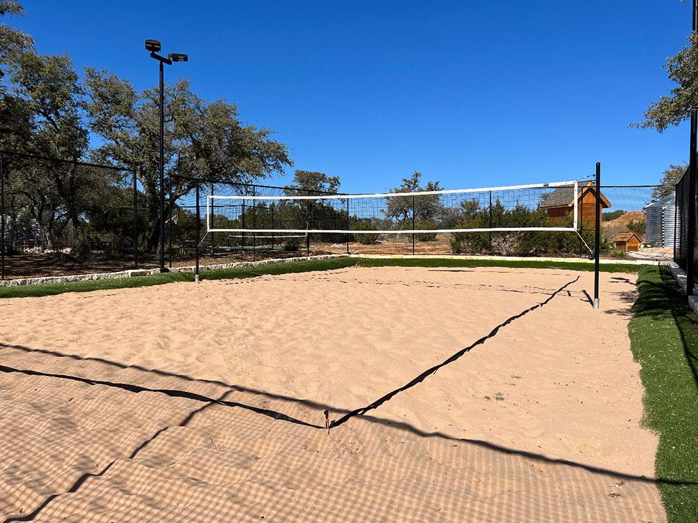 Sand volleyball court at RIVER'S EDGE CAMPGROUND