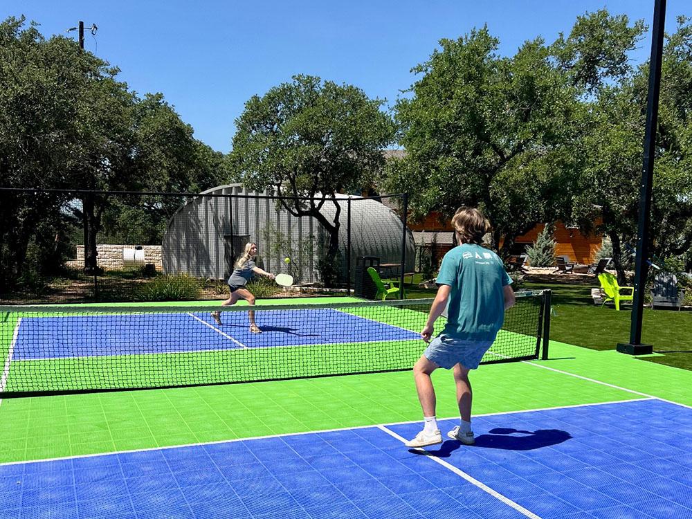 People playing pickle ball at RIVER'S EDGE CAMPGROUND