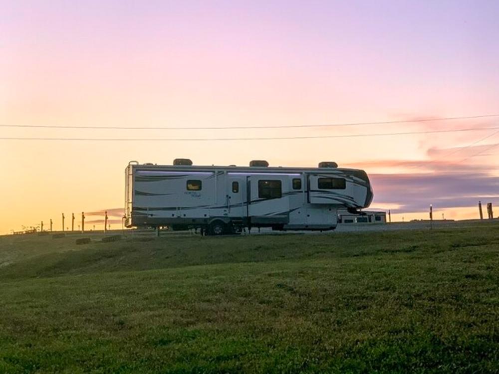 Travel trailer park at sunset at Escape With US RV Resort