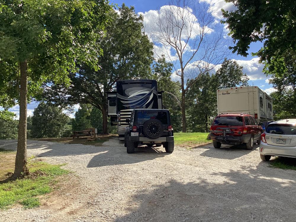 Shaded gravel sites at JESSIE JAMES JUNCTION RV PARK