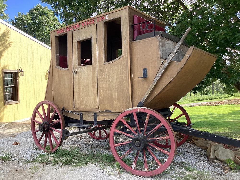 A wooden stagecoach at JESSIE JAMES JUNCTION RV PARK