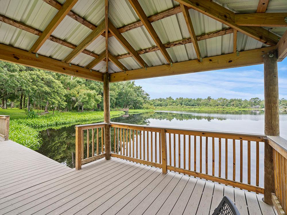 View of the lake from inside the gazebo at FARM OF DREAMS RESORT