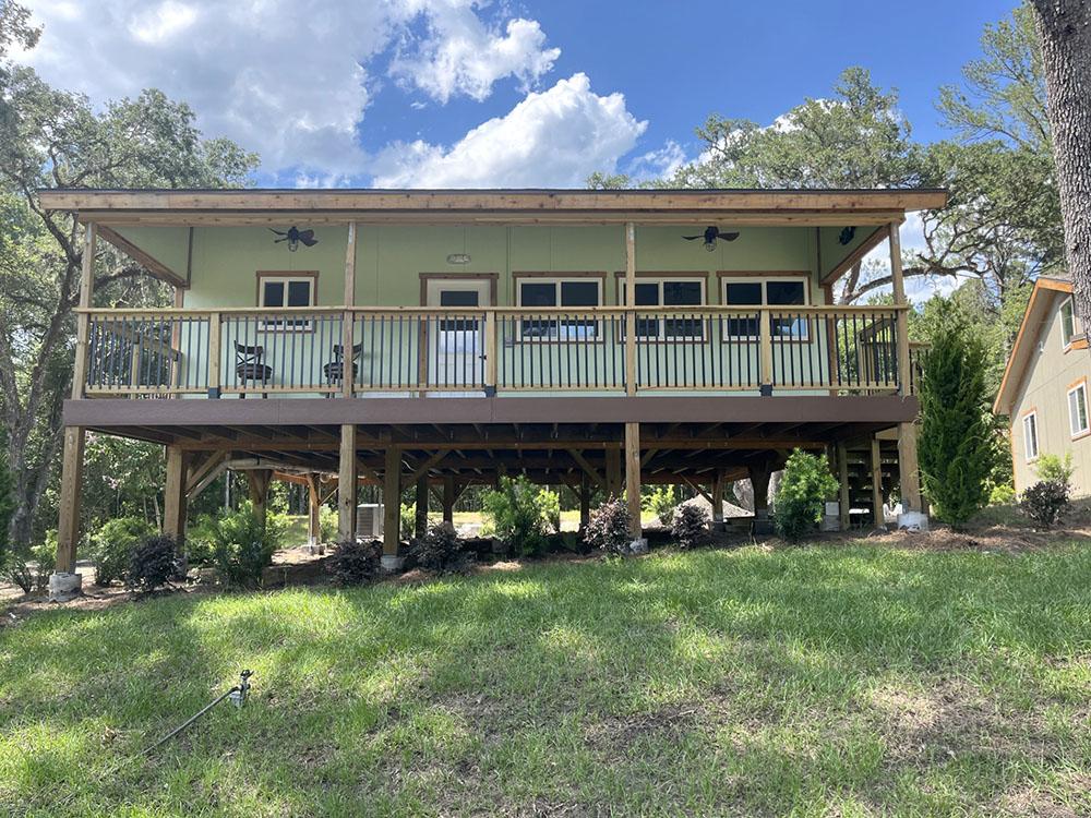 Exterior of a stilt house rental at FARM OF DREAMS RESORT