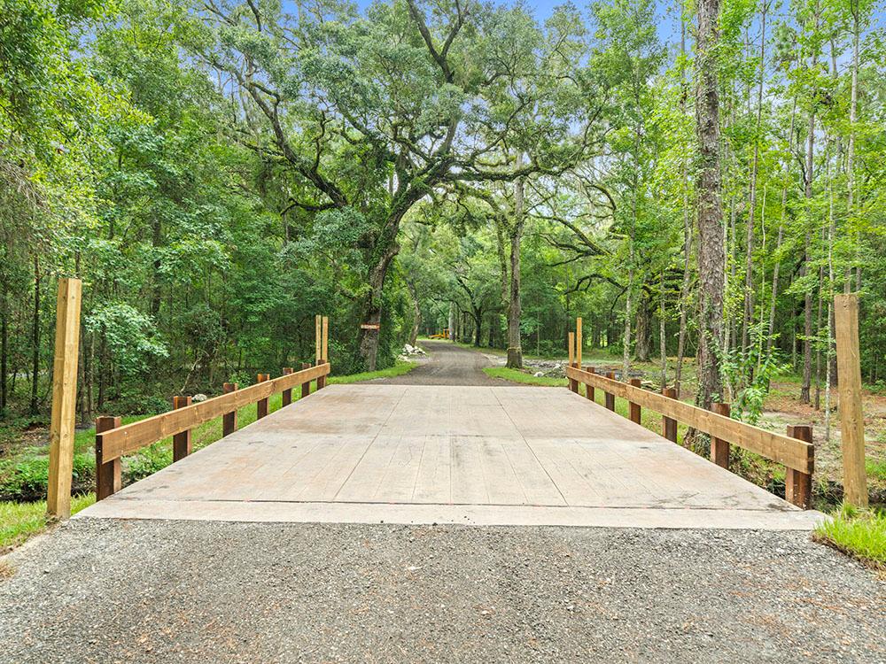 A driving bridge over a stream at FARM OF DREAMS RESORT