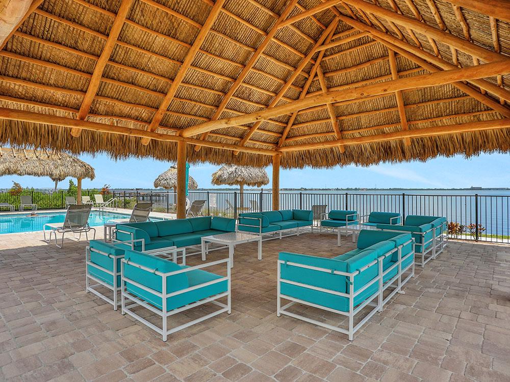 Covered seating with outdoor sofas at HARBOR VIEW ON THE BAY