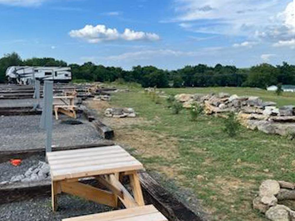 Picnic table at site at ROCK WALL RV PARK