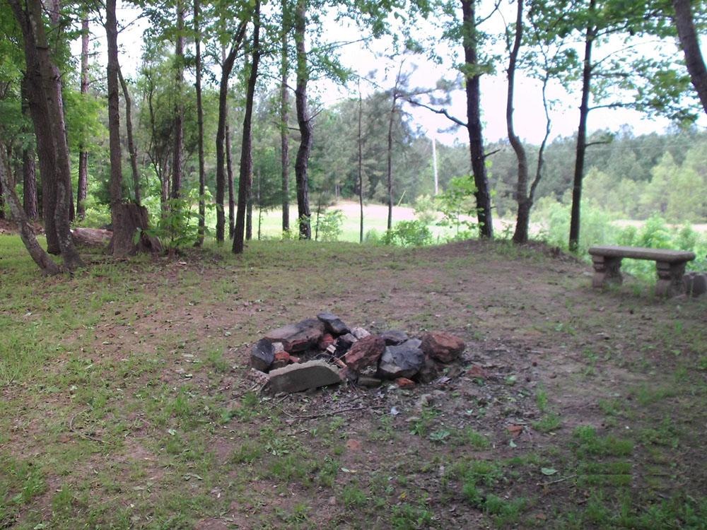 Stones for a fire pit in a tent site at PINE RIDGE RV PARK