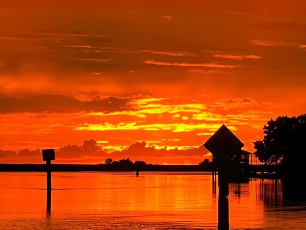 Orange and yellow sky at sunset at STEINHATCHEE VILLAGE RV PARK