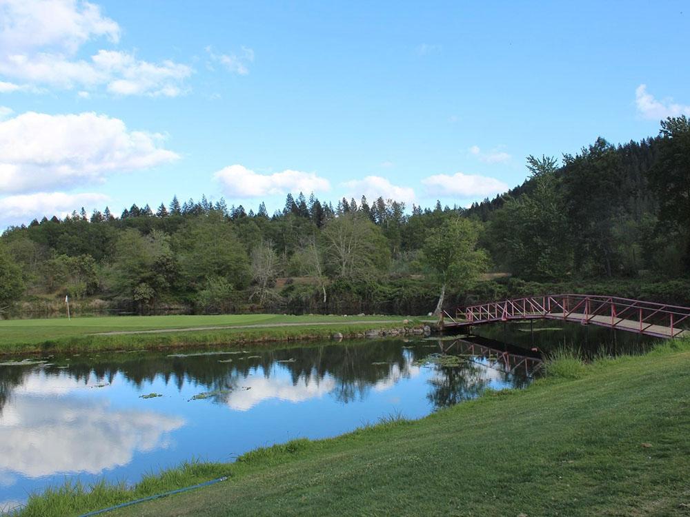 Bridge across a pond at APPLEGATE RV RESORT