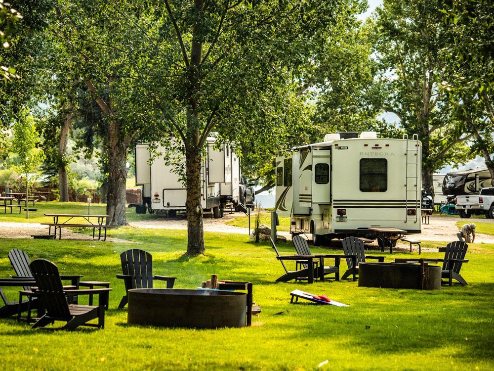 Fire pit and chairs at LAKESHORE CABINS AND CAMPGROUND