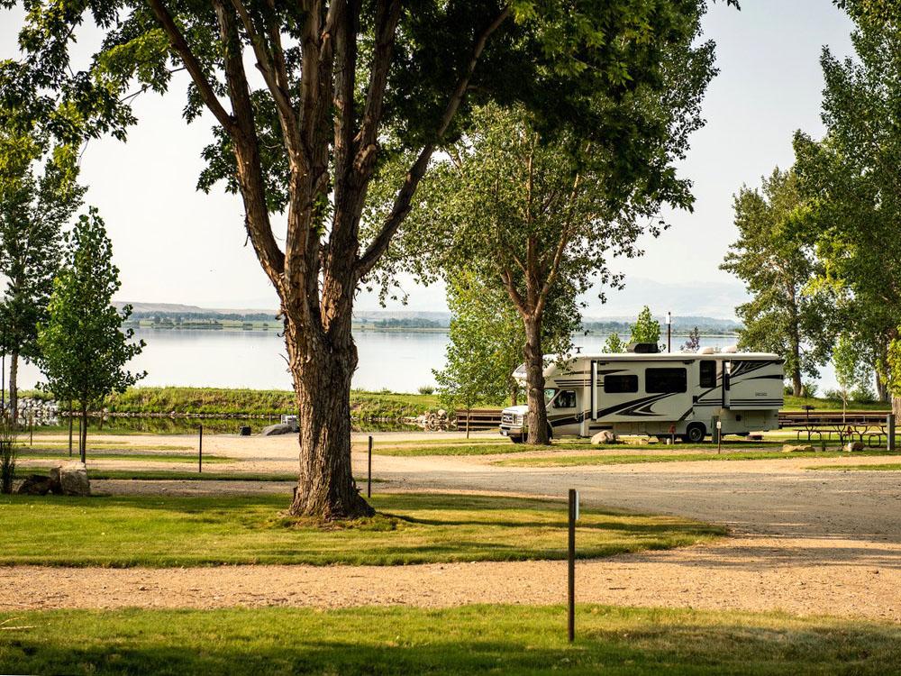 RV in a site at LAKESHORE CABINS AND CAMPGROUND