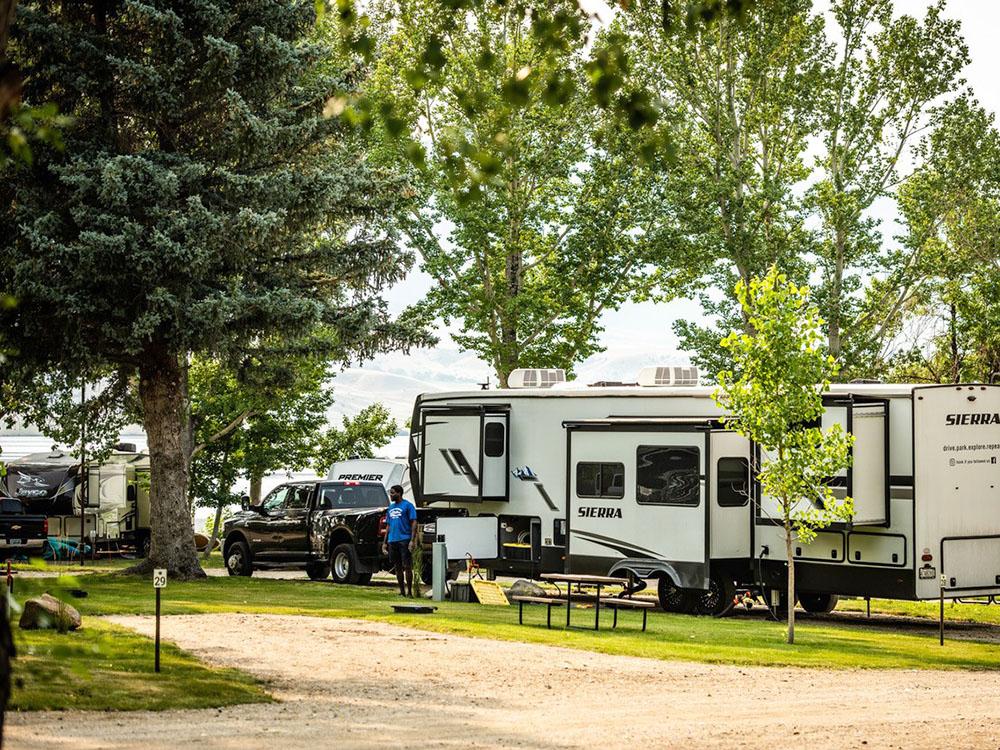 Camper outside his RV at LAKESHORE CABINS AND CAMPGROUND