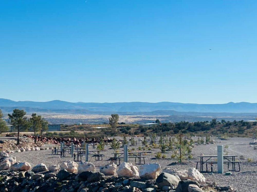 Rock wall next to picnic tables at COTTONWOOD SPRINGS RV RESORT