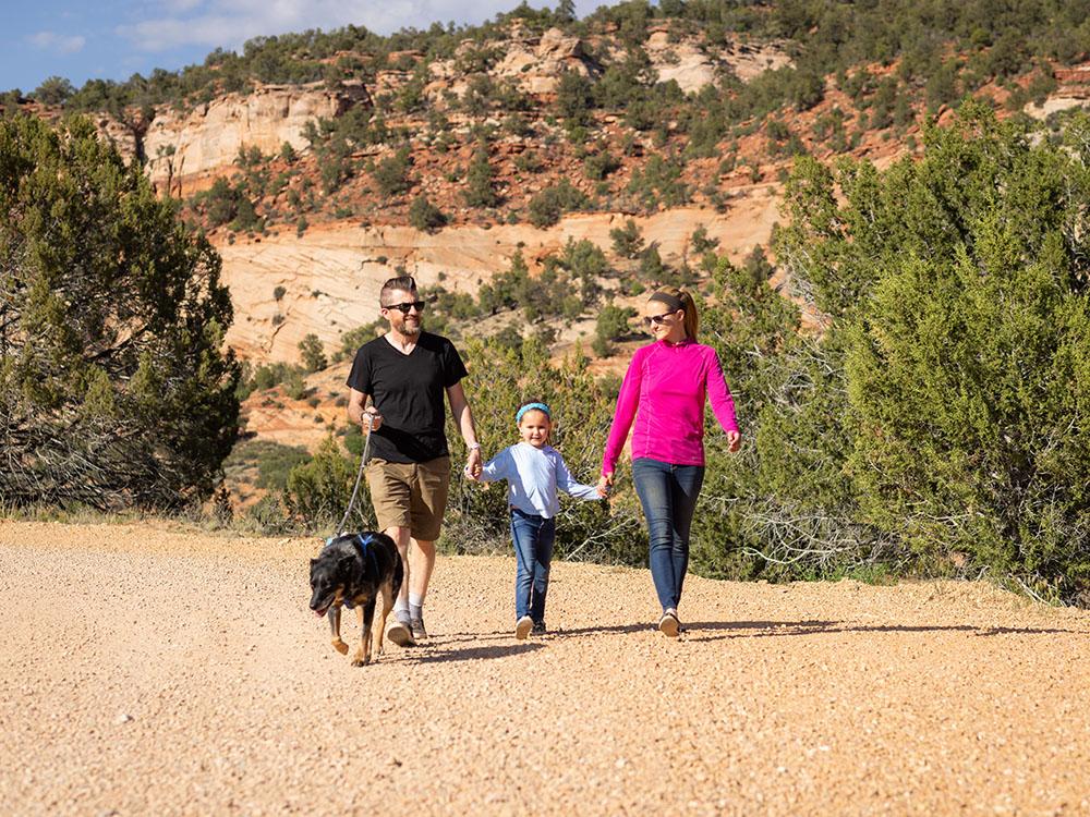 Family holding hands at BEST FRIENDS RV PARK