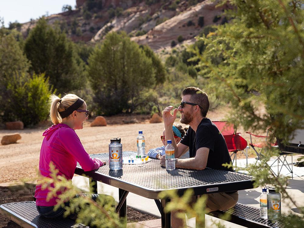 Drinking at a table at BEST FRIENDS RV PARK